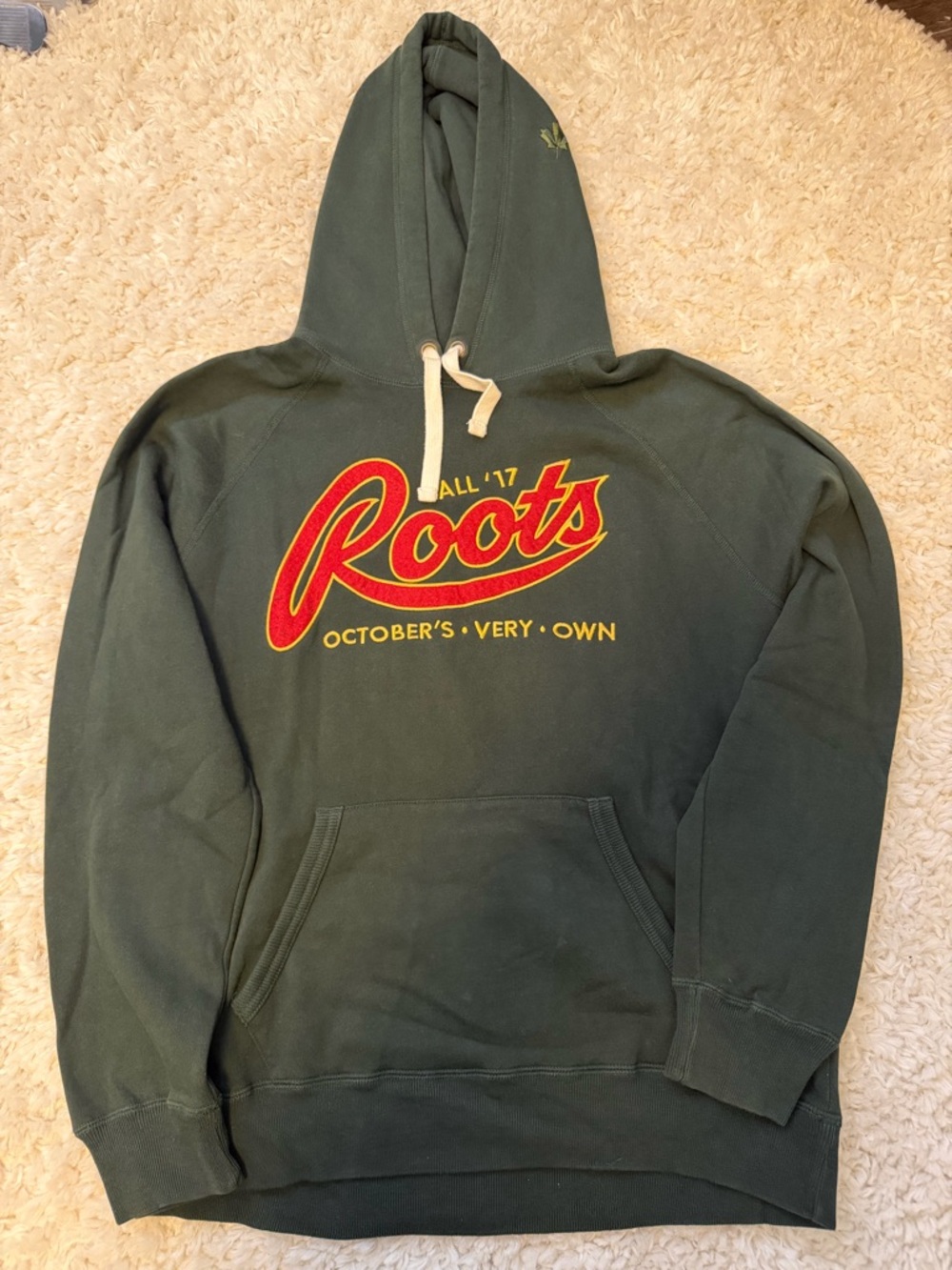 Roots Dark Green Hoodie with Red and Yellow Logo Accents